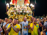 Sailors carry the statue of Our Lady of Martyrs on the occasion of the patronal feast day in Molfetta, Italy, on September 8, 2024. Septembe...