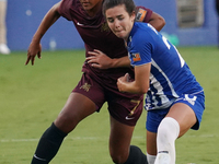 Enzi Broussard #7 of Dallas Trinity FC and Madison Murnin #20 battle for the ball during the USL Super League match between Dallas Trinity F...