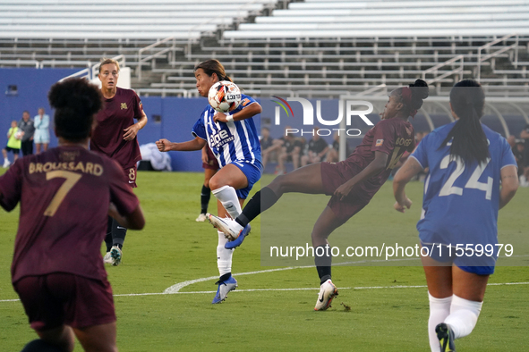 Chioma Ubogagu #14 of Dallas Trinity FC shoots the ball against Yuuka Kurosaki #19 of DC Power FC during the USL Super League match between...