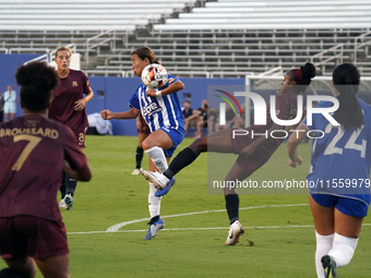 Chioma Ubogagu #14 of Dallas Trinity FC shoots the ball against Yuuka Kurosaki #19 of DC Power FC during the USL Super League match between...