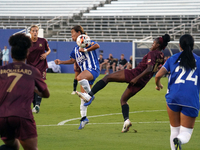 Chioma Ubogagu #14 of Dallas Trinity FC shoots the ball against Yuuka Kurosaki #19 of DC Power FC during the USL Super League match between...