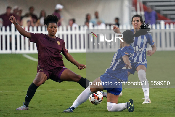 Enzi Broussard #7 of Dallas Trinity FC and Amber Diorio #24 slide to the ball during the USL Super League match between Dallas Trinity FC an...