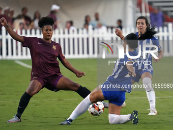 Enzi Broussard #7 of Dallas Trinity FC and Amber Diorio #24 slide to the ball during the USL Super League match between Dallas Trinity FC an...