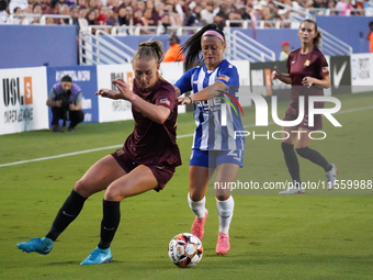 Allie Thornton #20 of Dallas Trinity FC drives the ball forward against Katrina Guillou #21 during the USL Super League match between Dallas...