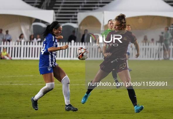 Allie Thornton #20 of Dallas Trinity FC and Amber Diorio #24 of DC Power FC battle for the ball during the USL Super League match between Da...