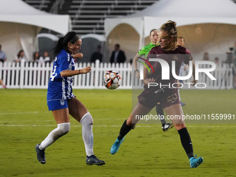 Allie Thornton #20 of Dallas Trinity FC and Amber Diorio #24 of DC Power FC battle for the ball during the USL Super League match between Da...