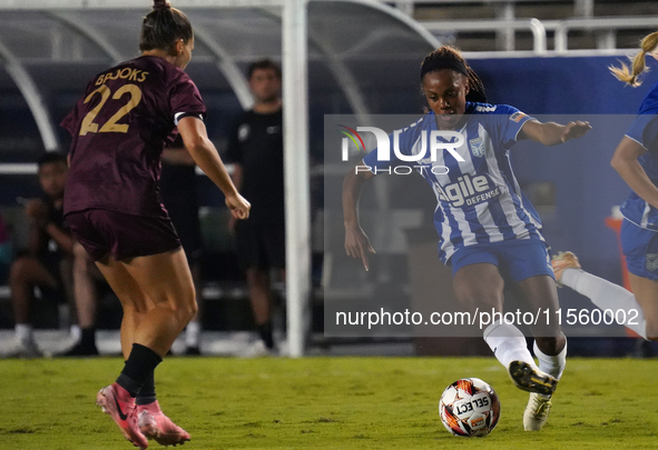 Mariah Lee #7 of DC Power FC drives the ball forward against Amber Brooks #22 of Dallas Trinity FC during the USL Super League match between...