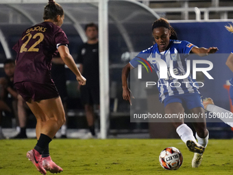 Mariah Lee #7 of DC Power FC drives the ball forward against Amber Brooks #22 of Dallas Trinity FC during the USL Super League match between...