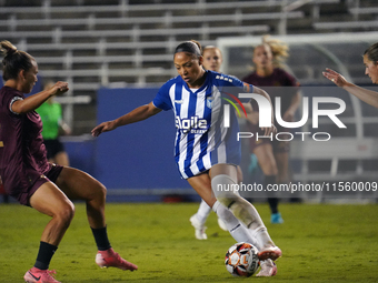 Jorian Baucom #5 drives the ball forward during the USL Super League match between Dallas Trinity FC and DC Power FC at the Cotton Bowl in D...