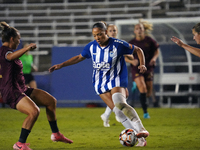 Jorian Baucom #5 drives the ball forward during the USL Super League match between Dallas Trinity FC and DC Power FC at the Cotton Bowl in D...