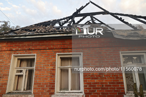 A house is damaged as a result of Russian shelling with cluster munitions in Derhachi, Kharkiv region, north-eastern Ukraine, on September 8...