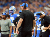 DETROIT,MICHIGAN-SEPTEMBER 8: Detroit Lions head coach Dan Campbell looks on from the sidelines during a game between the Detroit Lions and...