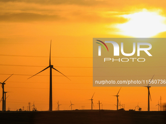 Wind power generation facilities on Zhangbei Bashang Grassland in Zhangjiakou, China, on June 28, 2013. (