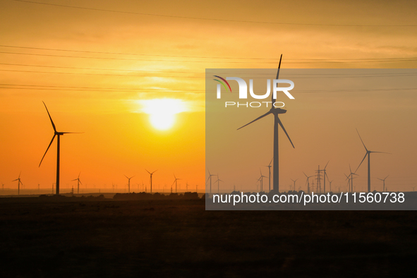 Wind power generation facilities on Zhangbei Bashang Grassland in Zhangjiakou, China, on June 28, 2013. 