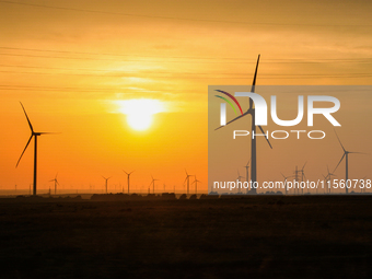 Wind power generation facilities on Zhangbei Bashang Grassland in Zhangjiakou, China, on June 28, 2013. (