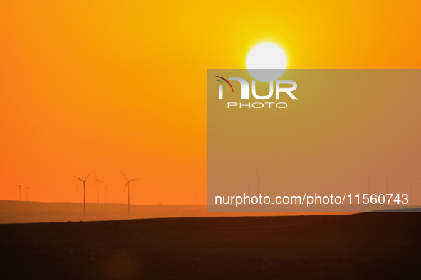 Wind power generation facilities on Zhangbei Bashang Grassland in Zhangjiakou, China, on June 28, 2013. 