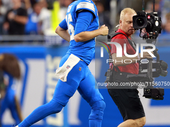 DETROIT,MICHIGAN-SEPTEMBER 8:  Quarterback Jared Goff (16) of the Detroit Lions runs off the field after winning the coin toss during overti...