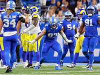 DETROIT,MICHIGAN-SEPTEMBER 8:  Defensive end Aidan Hutchinson (97) of the Detroit Lions celebrates a play during a game between the Detroit...