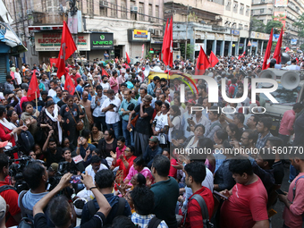 Activists Left Supporters shout slogans during a protest rally towards Lalbazar, the official Kolkata Police headquarters of West Bengal sta...