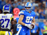 DETROIT,MICHIGAN-SEPTEMBER 8:  Tight end Sam LaPorta (87) of the Detroit Lions holds the ball after a play during a game between the Detroit...