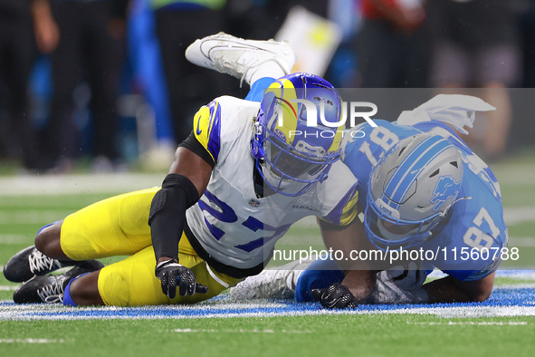 DETROIT,MICHIGAN-SEPTEMBER 8: Tight end Sam LaPorta (87) of the Detroit Lions is brought down by cornerback Tre'Davious White (27) of the Lo...