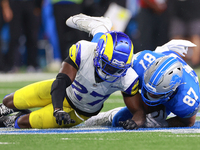 DETROIT,MICHIGAN-SEPTEMBER 8: Tight end Sam LaPorta (87) of the Detroit Lions is brought down by cornerback Tre'Davious White (27) of the Lo...