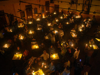 People light candles in solidarity with the victim of rape and murder at RG Kar Medical College, as seen at the iconic India Coffee House in...