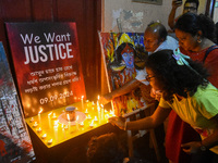 People light candles in solidarity with the victim of rape and murder at RG Kar Medical College, as seen at the iconic India Coffee House in...