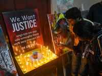 People light candles in solidarity with the victim of rape and murder at RG Kar Medical College, as seen at the iconic India Coffee House in...