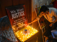 People light candles in solidarity with the victim of rape and murder at RG Kar Medical College, as seen at the iconic India Coffee House in...