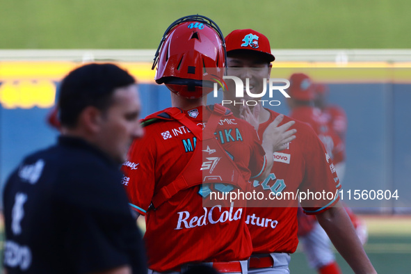 Tomohiro Anraku #20 of Diablos Rojos celebrates during the resumption of the 2024 King Series match 3 against Sultanes de Monterrey of the M...