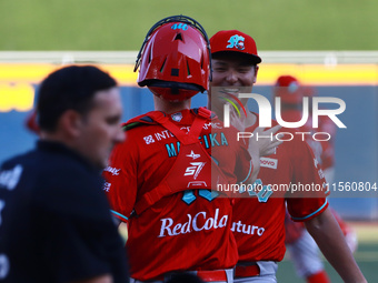 Tomohiro Anraku #20 of Diablos Rojos celebrates during the resumption of the 2024 King Series match 3 against Sultanes de Monterrey of the M...