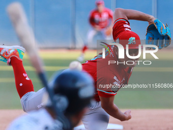 Tomohiro Anraku #20 of Diablos Rojos pitches the ball during the Resumption of the 2024 King Series match 3 against Sultanes de Monterrey of...