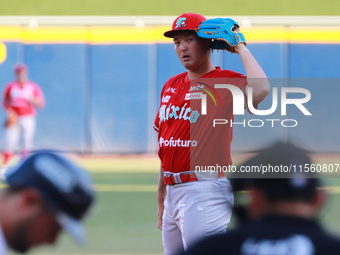 Tomohiro Anraku #20 of Diablos Rojos pitches the ball during the Resumption of the 2024 King Series match 3 against Sultanes de Monterrey of...