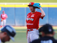 Tomohiro Anraku #20 of Diablos Rojos pitches the ball during the Resumption of the 2024 King Series match 3 against Sultanes de Monterrey of...