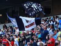 Sultanes de Monterrey fans wave their team flags during the resumption of the 2024 King Series match 3 of the Mexican Baseball League (LMB)...