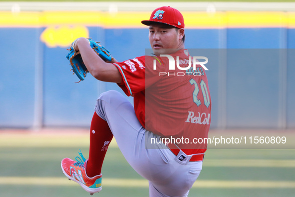 Tomohiro Anraku #20 of Diablos Rojos pitches the ball during the Resumption of the 2024 King Series match 3 against Sultanes de Monterrey of...