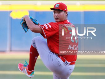 Tomohiro Anraku #20 of Diablos Rojos pitches the ball during the Resumption of the 2024 King Series match 3 against Sultanes de Monterrey of...