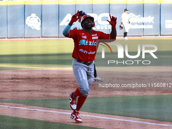 Jose Pirela #67 of Diablos Rojos celebrates after hitting a home run during the Resumption of the 2024 King Series match 3 against Sultanes...