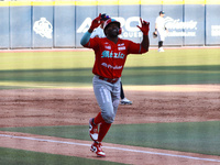 Jose Pirela #67 of Diablos Rojos celebrates after hitting a home run during the Resumption of the 2024 King Series match 3 against Sultanes...