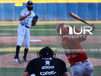 Jose Marmolejos #46 of Diablos Rojos hits the ball during the Resumption of the 2024 King Series match 3 against Sultanes de Monterrey of th...