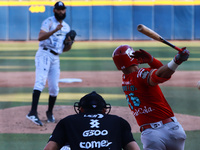 Jose Marmolejos #46 of Diablos Rojos hits the ball during the Resumption of the 2024 King Series match 3 against Sultanes de Monterrey of th...