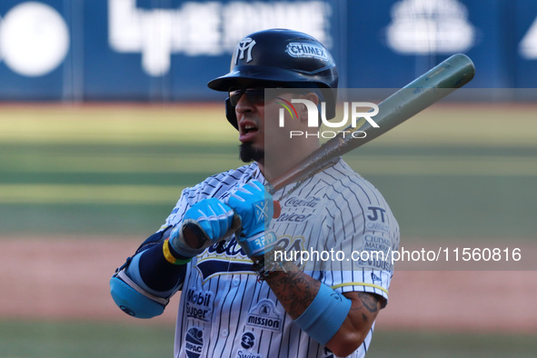 Ramiro Pena #19 of Sultanes de Monterrey bats during the resumption of the 2024 King Series match 3 against Diablos Rojos of the Mexican Bas...