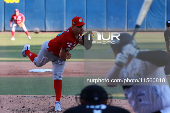 Edwin Fierro #58 of Diablos Rojos pitches the ball during the resumption of the 2024 King Series match 3 against Sultanes de Monterrey of th...