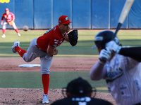 Edwin Fierro #58 of Diablos Rojos pitches the ball during the resumption of the 2024 King Series match 3 against Sultanes de Monterrey of th...