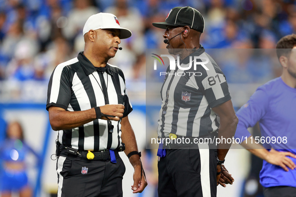 DETROIT,MICHIGAN-SEPTEMBER 8:  Referee Adrian Hill (29) talks with umpire Roy Ellison (81) during a game between the Detroit Lions and the L...