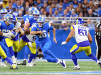 DETROIT,MICHIGAN-SEPTEMBER 8:  Quarterback Jared Goff (16) of the Detroit Lions carries the ball during a game between the Detroit Lions and...