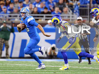 DETROIT,MICHIGAN-SEPTEMBER 8:  Quarterback Jared Goff (16) of the Detroit Lions runs the ball pursued by safety Quentin Lake (37) of the Los...