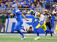 DETROIT,MICHIGAN-SEPTEMBER 8:  Quarterback Jared Goff (16) of the Detroit Lions runs the ball pursued by safety Quentin Lake (37) of the Los...