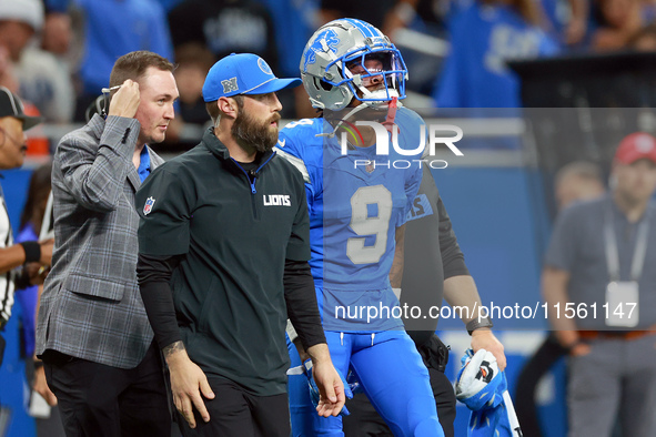 DETROIT,MICHIGAN-SEPTEMBER 8:  Wide receiver Jameson Williams (9) of the Detroit Lions walks off the field after being checked for injury du...